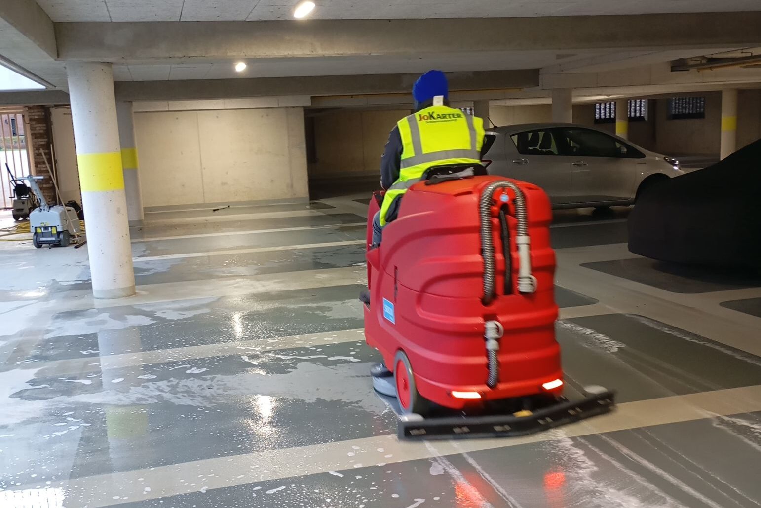Machine cleaning a parking lot